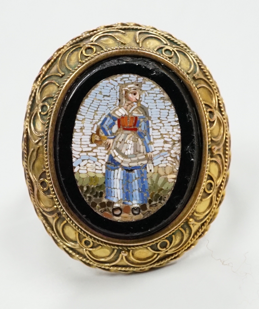 A 19th century yellow metal and micro mosaic set oval ring, size O, gross weight 5.9 grams.